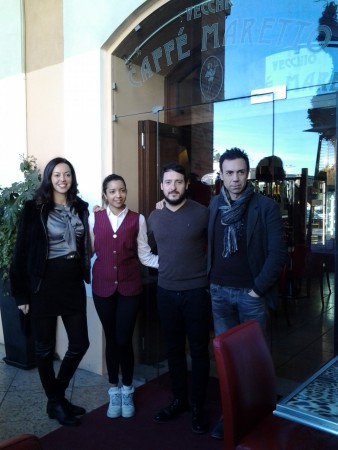 Caterina Pancotto della Firs comunicazione assieme a Gianluca Antonietti organizzatori dell'evento con il titolare del Caffè Maretto